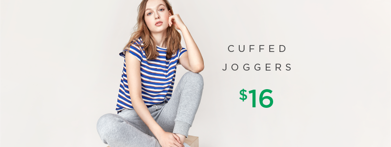 young woman in cuffed joggers young woman in cuffed joggers