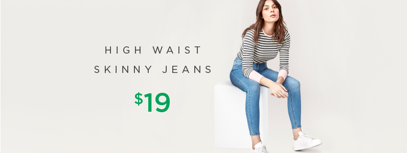 young woman in high waist skinny jeans young woman in high waist skinny jeans